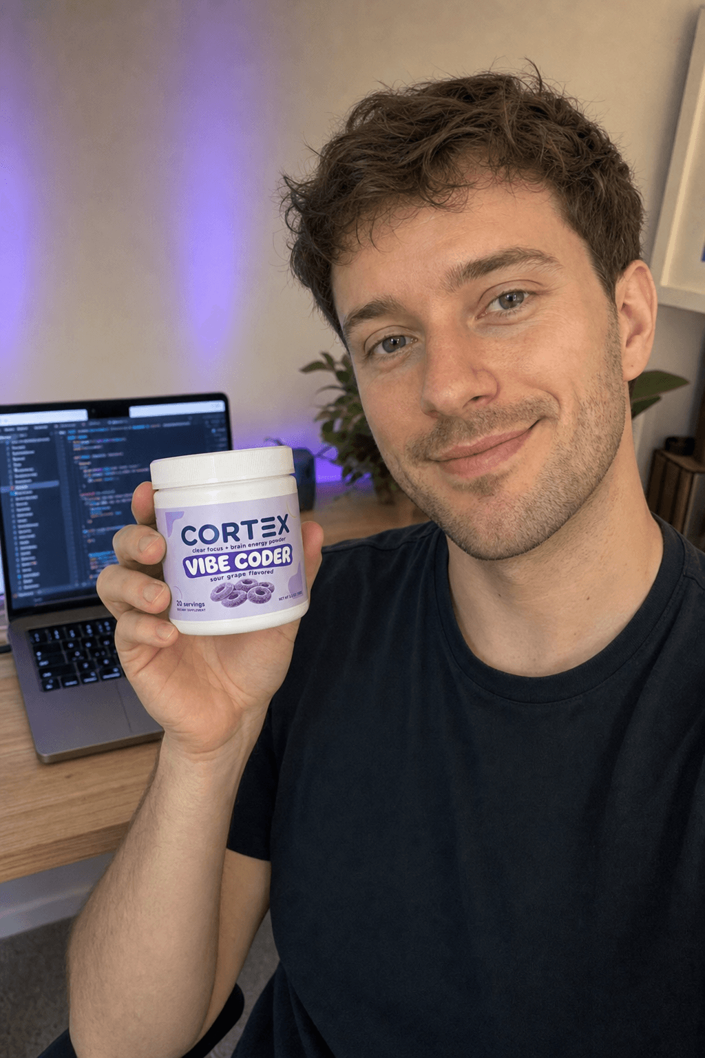 A CORTEX creator partner holding Vibe Coder at his desk